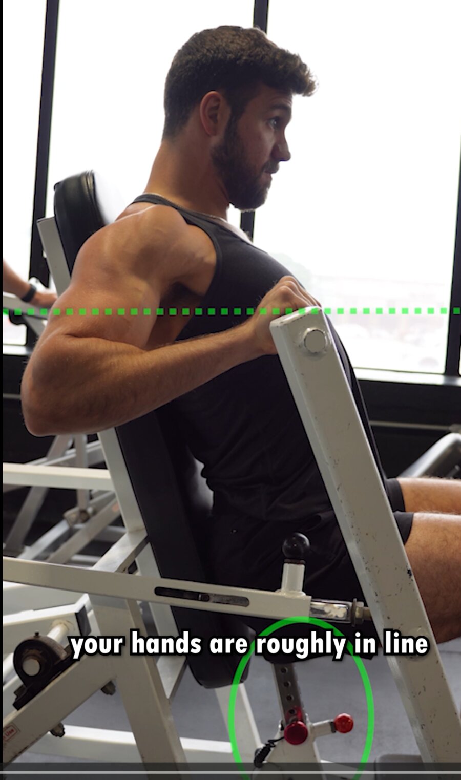 Bottom of a chest press — hands roughly in line with the chest