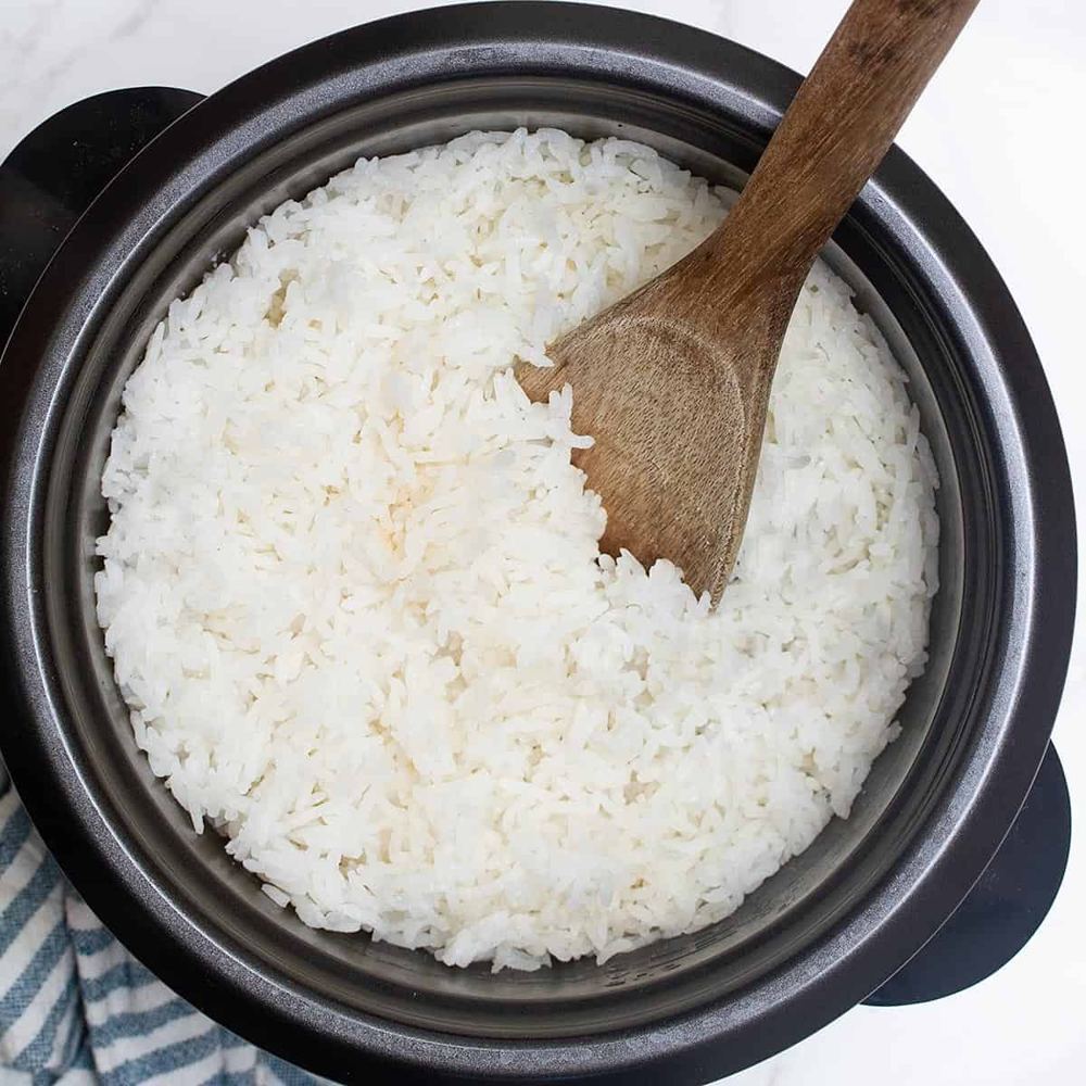 Fresh white rice in a rice cooker pot