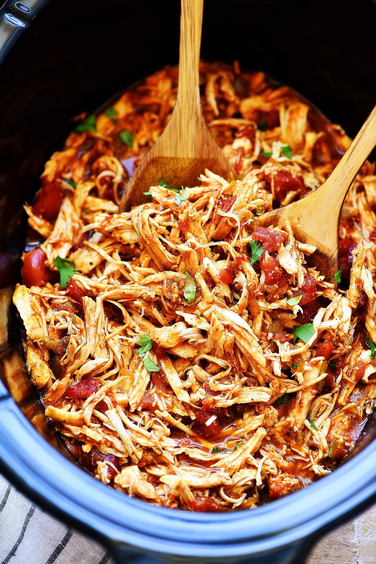 Shredded slow-cooked chicken in a crockpot